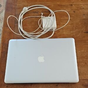 Apple MacBook 15" For Parts.  Comes With Charger HARD DRIVE HAS BEEN REMOVED!